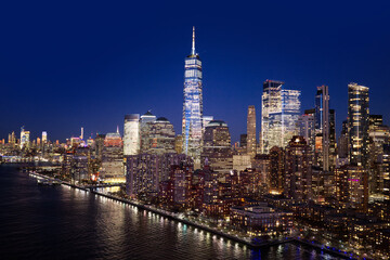 Obraz premium New York City landscape with skyscrapers. New York night skyline view. NYC metropolis aerial view at night. New York City panoramic night view of Manhattan.