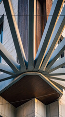 Obraz premium Architectural detail with angular metal beams and wooden panels.