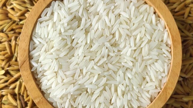 close-up of rice grains in a wooden bowl.