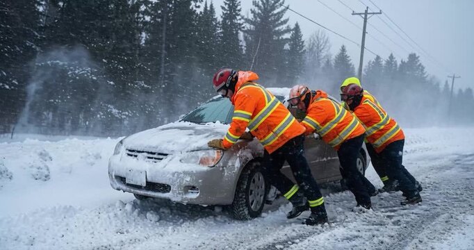 People pushing car through snowstorm winter scene