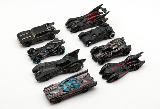 Bologna - Italy - February 10, 2026: Collection of various Batman Batmobile toy cars by Hot Wheels isolated on white.