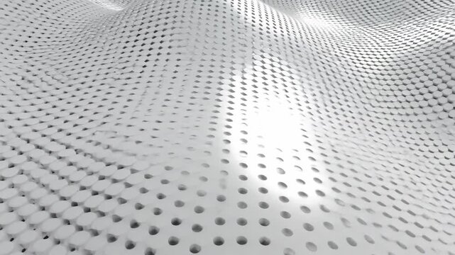 Abstract wavy perforated metal surface pattern with soft lighting