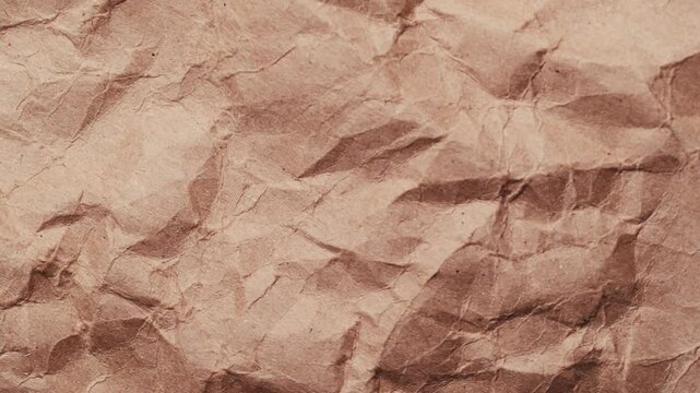 Stop motion of crumpled craft brown paper texture, abstract loop background