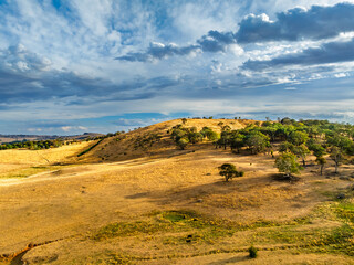 Cloud‑Laced Skies at Golden Hour Over Farmland