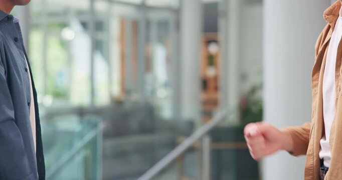 Business people, meeting or greeting with fist bump for introduction, partnership or deal in office. Closeup, employees or colleagues with secret handshake for friendship or teamwork in workplace