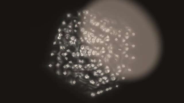 A nebulous oval shape with shimmering, geometric elements against a dark background