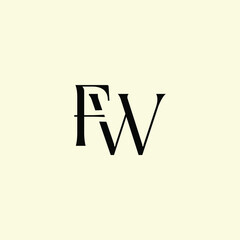 Obraz premium Elegant Intertwined F and W logo design. FW monogram. Modern, sophisticated branding symbol suitable for luxury fashion, design studios, and editorial logos.
