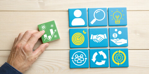 Business strategy concepts and growth planning with Hands are creating icon blocks related to sustainable financial growth