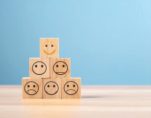Wooden blocks with smiling, neutral, and frowning faces