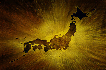 	黄金の後光が射す古風で粗い金屏風絵風背景に暗く日本列島シルエットに切り抜かれた地図イメージ