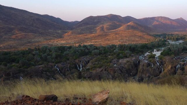 Pan on Epupa falls at sunset in Kaokoland in Namibia, Africa.