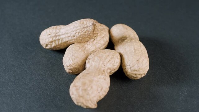 Whole peanot in shell on black background