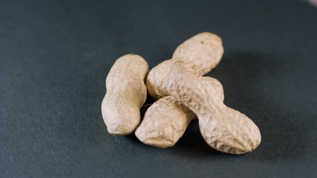 Whole peanot in shell on black background