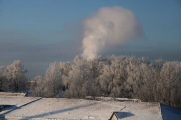 severe frost, smoke rising, clear sky, roof of a house,