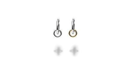 Modern mixed metal hoop earrings, one silver and one gold hoop, minimalist two-tone jewelry design.