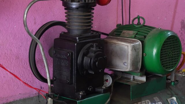 Running reciprocating air compressor pumps