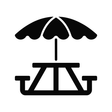 Picnic table with umbrella for outdoor dining and relaxation