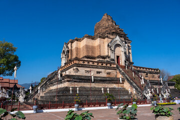 Separate fragments of a decorated Buddhist temple in Thailand on a sunny day