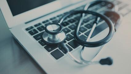 Doctor table with computer and stethoscope