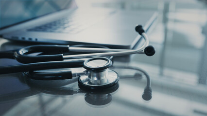 Doctor table with computer and stethoscope