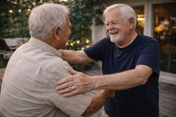  Two senior men share a heartfelt hug and smiles outdoors, symbolizing enduring friendship, warm greetings, and joyful social connections.
