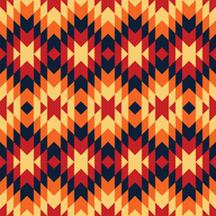 Seamless geometric tribal pattern with ethnic Navajo motifs in warm sunset colors