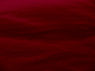 Abstract view of red sand dunes or snow on an alien planet surface.