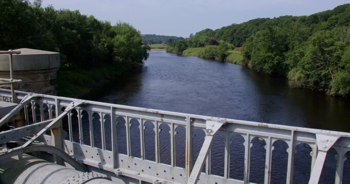 wide shot looking up the river Lune from the Thirlmere aqueduct waterworks,