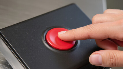 finger pressing the button