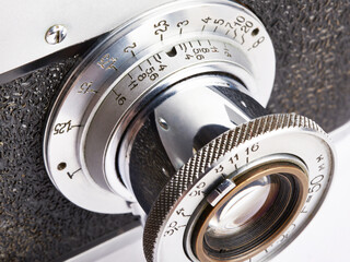 Distance and aperture scale on lens of old camera