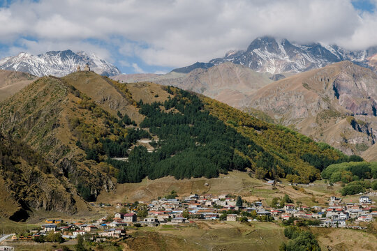 Stepantsminda village with Mount Kazbek and Gergeti Trinity Church, Georgia
