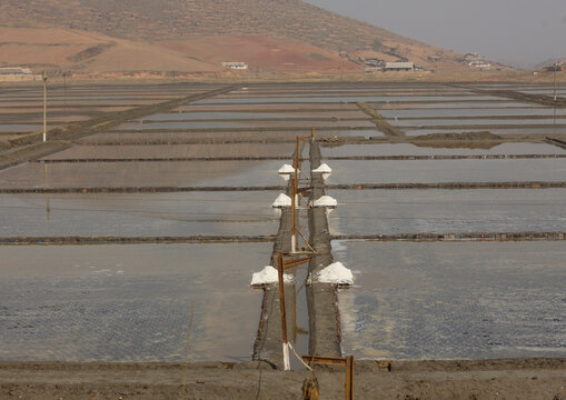 North Korean people working in salt evaporation ponds, South Pyongan Province, Nampo, North Korea