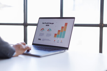 Accounting report spreadsheet. Business women using computer prepare business report for evaluation...