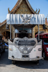 Separate fragments of a decorated Buddhist temple in Thailand on a sunny day