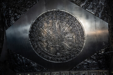 Separate fragments of a decorated Buddhist temple in Thailand on a sunny day