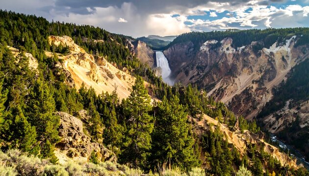 Majestic Waterfall Cascades Through Yellowstone National Park Canyon.