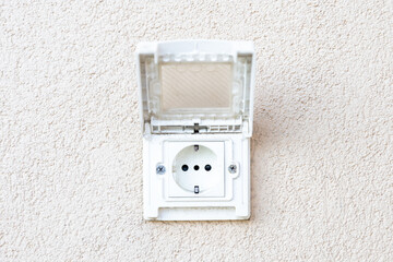 Outdoor electrical socket with lifted clear plastic cover