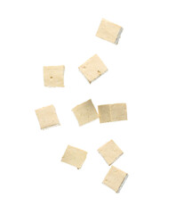 Obraz premium Pieces of flying tasty tofu cheese isolated on white background