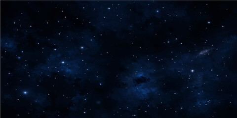 Obraz premium A cosmic night sky starfield features a dark universe filled with a glowing blue nebula and starry light across the vast outer space galaxy