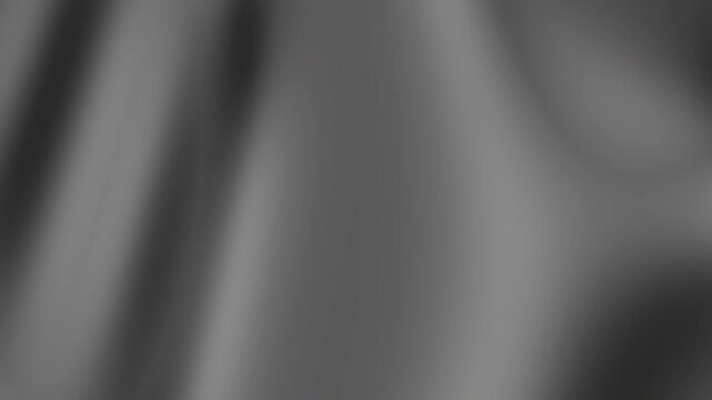 A close-up blurred image of a gray fabric texture from a high angle viewpoint