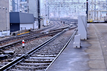 Fototapeta premium Complex railway switches and tracks at a station. Functional beauty of Japanese rail infrastructure.