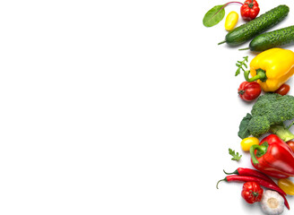 Fresh healthy vegetables creating a vibrant frame on white background