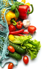 Fresh organic vegetables in a reusable mesh bag