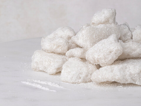 Stuck ofwhite Crystalline Chunks of white crystalline chunks of snorting drugs on a light background