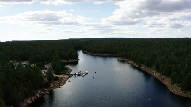 Wide drone shot over the Woods Canyon Lake marina and park facility in rural Arizona.