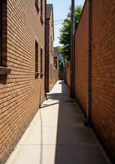 Bricked Alleyway Vividly Leads to an Open Glimmer
