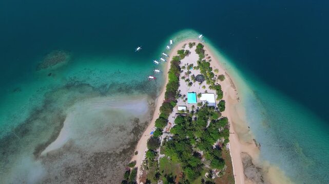 Cinematic drone panorama of tropical Cowrie island paradise in the Philippines, Palawan. aerial view of beauty of Puerto Princesa from above
