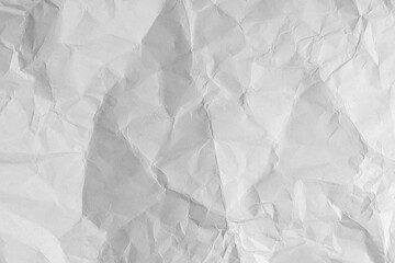 Old crumpled paper sheet with torn edges and weathered texture. Blank white background ideal effect.