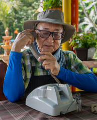 A farm man calling on the phone