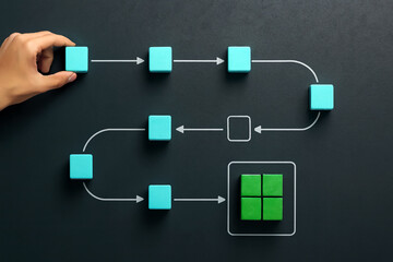 Fototapeta premium Flowchart diagram with blue square blocks connected by white arrows on purple background. Hand placing block suggests workflow, decision-making, data flow, and organizational process illustration.
